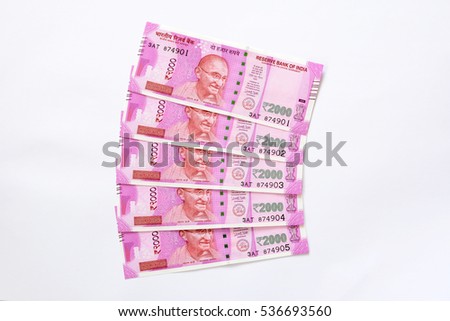 5 Two Thousand Indian Rupee notes on white background. Royalty-Free Stock Photo #536693560