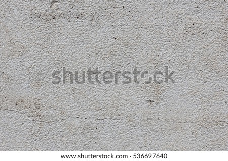 Plastered cracked gray wall abstract texture background