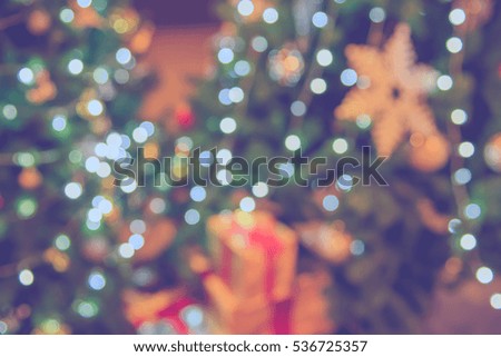 abstract blur image of shopping mall  on christmas time for background . (vintage tone)