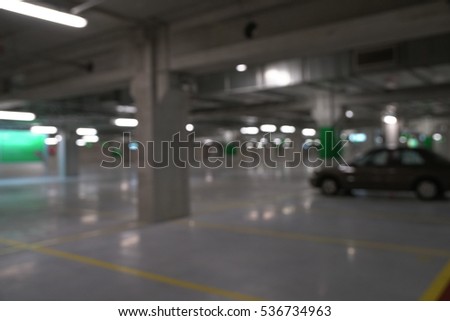 Abstract blurred car in parking background 