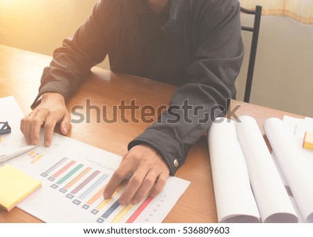 business documents on office table with glasses and analysis graph paper Turnover  in the background.