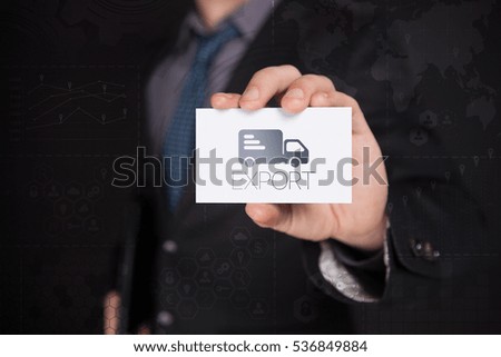 Businessman Holding White Visit Card With Icon And Text Export, Touch Screen. Virtual Icon. Graphs Interface. Business concept. Internet concept. Digital Interfaces