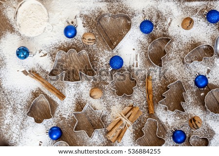 Christmas food background with cookies molds and flour