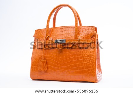 Crocodile skin bag orange leather texture background,genuine crocodile leather