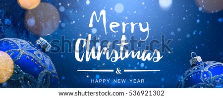 christmas decoration on blue snow background; copy space.