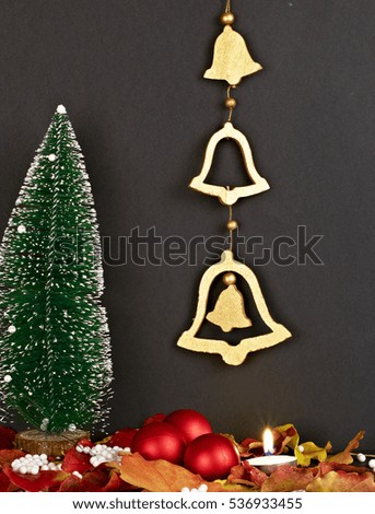 Christmas tree with bells on black background