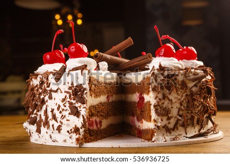 chocolate cheesecake with chocolate glaze on white wood background. tinting. selective focus