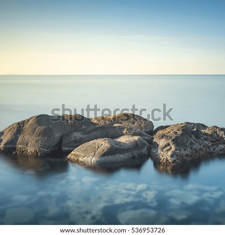 Rocks and sea in zen style. Long exposure photography