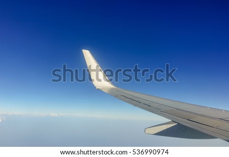 Winglet of the B737-900 in the blue sky Royalty-Free Stock Photo #536990974