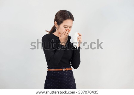 woman office : sneezing  working woman with tissue paper have a cold