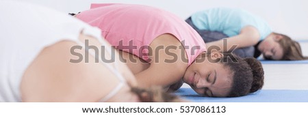 Shot of a group of women relaxing during yoga class