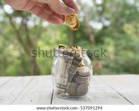 putting coins concept of banking, finance and savings.