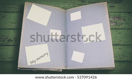 Photo album with stickers, inscription on paper stickers