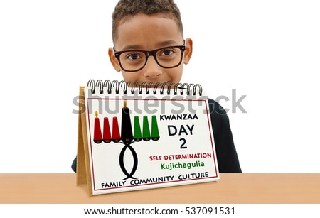 Kwanzaa Calendar Day Two Self Determination (Kujichagulia) Family Community Culture School Age Boy Smiling wearing eye glasses  looking at camera