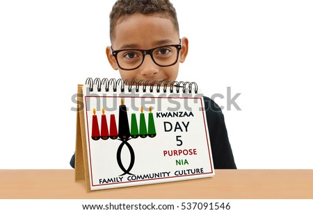 Kwanzaa Calendar Day Five Purpose (Nia) Family Community Culture School Age Boy Smiling wearing eye glasses  looking at camera