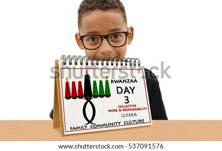 Kwanzaa Calendar Day Three Collective Work and Responsibility (Ujima) Family Community Culture School Age Boy Smiling wearing eye glasses  looking at camera