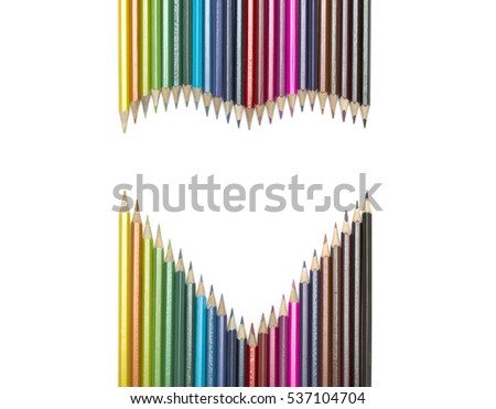 View at colored pencils laid out in the shape of heart