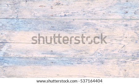 Old wooden wall in light colors, detailed background photo texture. Natural wooden building structure background. Plank fence close up.