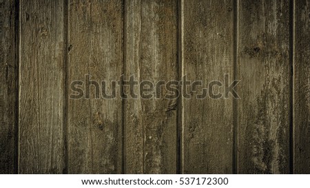 Old rural wooden wall in dark colors, detailed plank photo texture. Natural wooden building structure background.