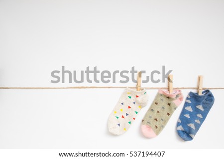 Socks hanging with clipping path on white background.