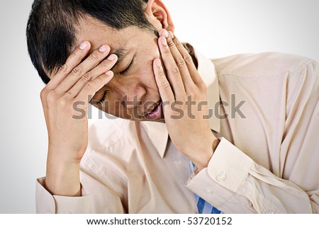 Sick businessman portrait of Asian with painful expression.
