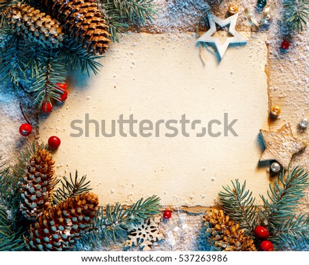 Christmas greeting card with fir branches, pinecones on table. Merry Christmas and Happy New Year!! Top view.