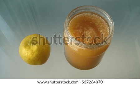 In the foreground is a jar of honey and lemon. This is a healthy diet, rich in vitamins.