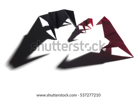 Colored origami birds isolated over white background