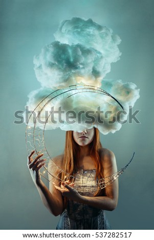 Daydreamer. Head in the clouds. Girl holding a moon in her hands. Fantasy concept. Dreaming.