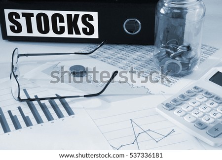 Stocks folder with charts and coins