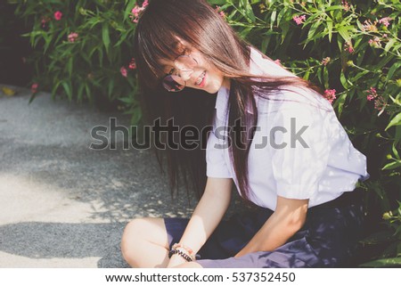 Portrait of thai high school student uniform teen glasses beautiful girl happy and relax