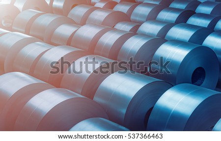Cold rolled steel coil at storage area in steel industry plant. Vintage blue tone Royalty-Free Stock Photo #537366463
