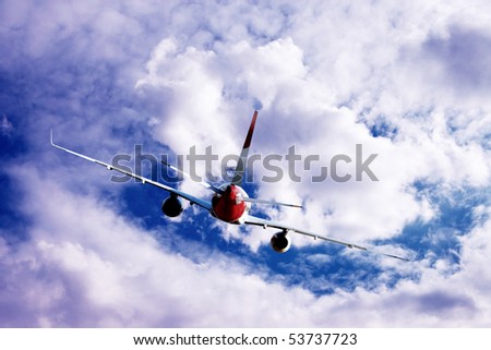 Airplane at fly on the sky with clouds
