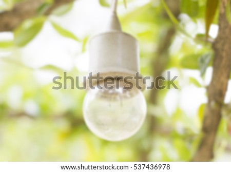 Blur Spherical lamp in gothic style surrounded by trees
