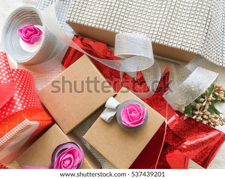 Christmas gifts packaging with cardboard boxes and silk colorful ribbons Holiday wallpaper background