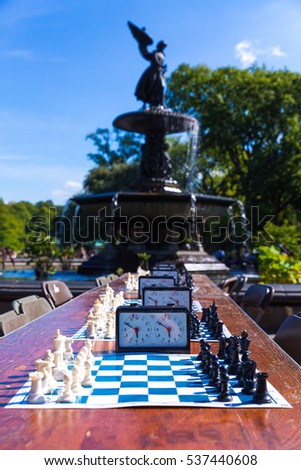 Tournament Chess boards with a fountain in the background
