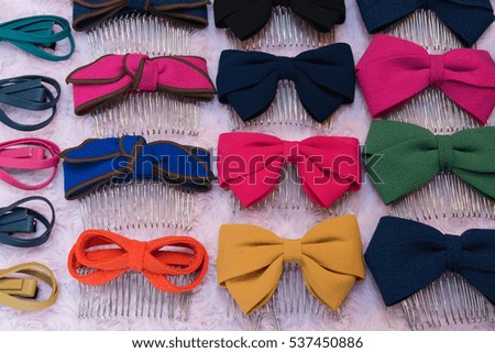 Collection set of colorful ribbon bows on a white table.