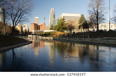 Sunrise and the city skyline reflected in the river