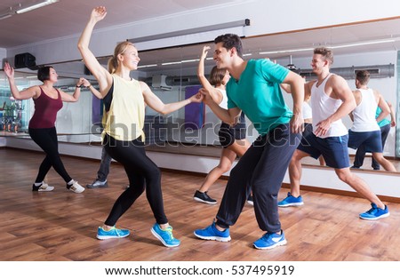 Dancing happy couples learning swing at dance class Royalty-Free Stock Photo #537495919
