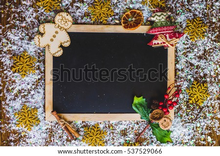 Christmas photo frame card, on a wooden background.