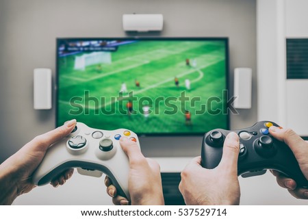 gaming game play tv fun gamer gamepad guy controller video console playing player holding hobby playful enjoyment view concept - stock image Royalty-Free Stock Photo #537529714