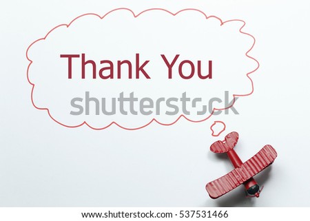 writing thank you red toy airplane with talk bubble on white background