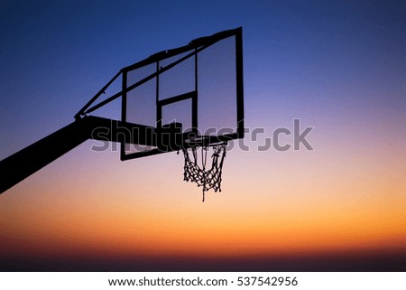 Basketball at sunset silhouette