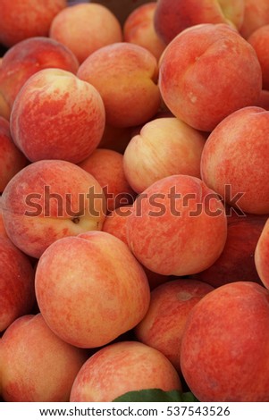 White Peaches: Fresh peaches looked tempting in the Farmer's Market. Royalty-Free Stock Photo #537543526