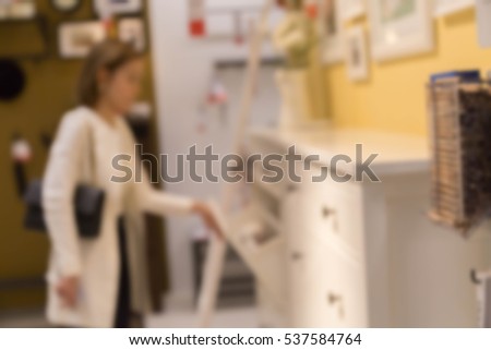 blur picture background  of wooden chest of drawer in furniture mall
