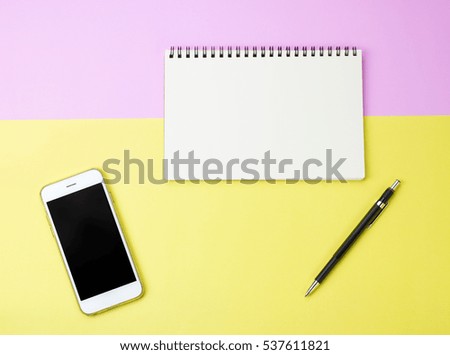 flat lay photo of blank notebook, pencil and smart phone with copy space background, minimal style