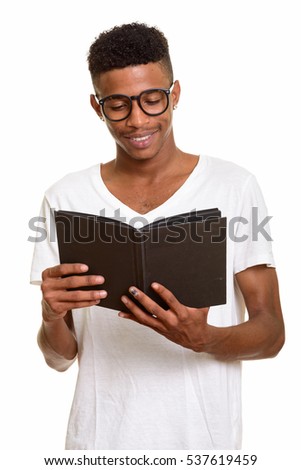 Young happy African man reading book