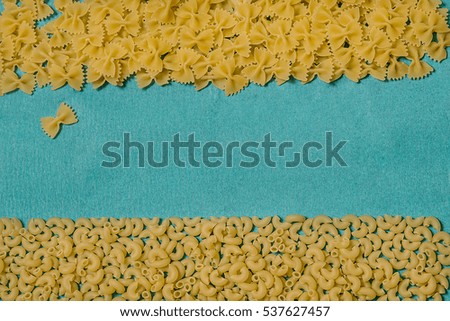 Pasta on a blue background. Bright and cheerful picture.