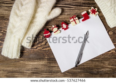 Christmas banner. Letter to Santa Claus. Wish list. Winter background. Hands in mittens.