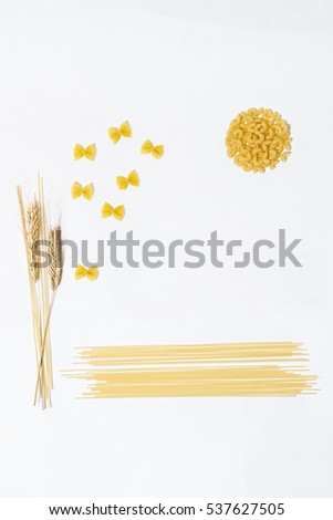 Pasta,  spaghetti and wheat on a white background. Bright and cheerful picture.